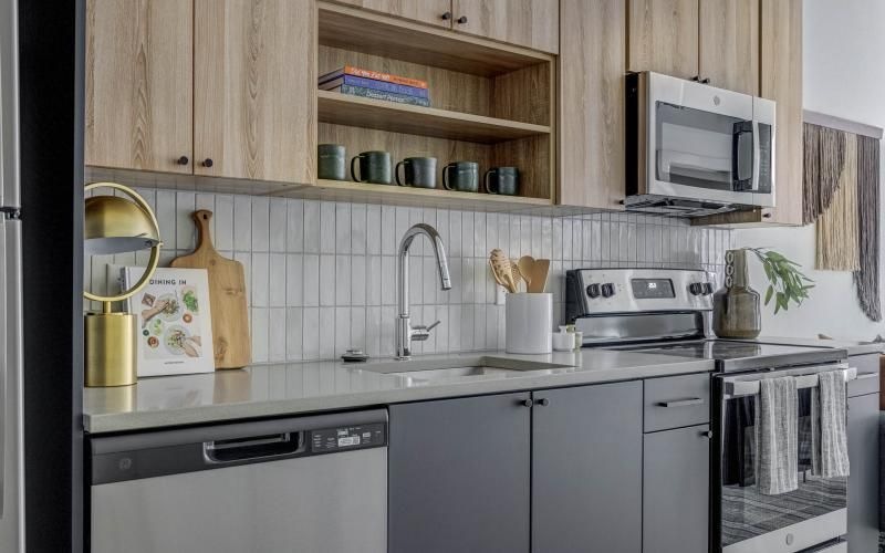 a kitchen with wooden cabinets