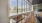 a room with a large window and chairs