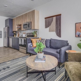 Settle into comfort at Slate a living room with a couch and a table