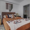 bedroom with large bed and bookshelf
