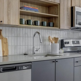 Spacious kitchens with thoughtful details a kitchen with wooden cabinets