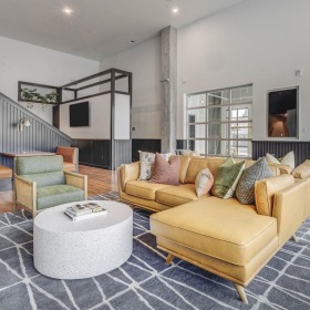 Access to resident-only features a living room with a large glass wall
