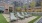 a courtyard with benches and tables